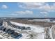 Aerial view of a neighborhood featuring homes with a pond, a commercial building and a partly cloudy sky at 20170 Edwick Dr, Westfield, IN 46074