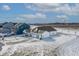 Aerial view of a neighborhood featuring homes with three-car garages surrounded by snow and partly cloudy skies at 20170 Edwick Dr, Westfield, IN 46074