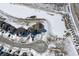 Aerial view of a home featuring a pond, roads, and other houses in the neighborhood on a snowy day at 20170 Edwick Dr, Westfield, IN 46074