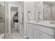 Elegant bathroom with a double sink vanity, granite counters, and a walk-in shower at 20170 Edwick Dr, Westfield, IN 46074