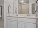 Modern bathroom with a double sink vanity, sleek fixtures, and a glass-enclosed shower at 20170 Edwick Dr, Westfield, IN 46074