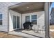 Relaxing covered patio with space for outdoor seating and a grill, perfect for summer gatherings at 20170 Edwick Dr, Westfield, IN 46074