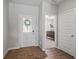 Inviting entryway featuring a stylish white door and views into an adjacent room with a wooden desk at 20170 Edwick Dr, Westfield, IN 46074