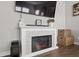 Modern fireplace featuring white mantle and stone veneer detail and built in storage at 20170 Edwick Dr, Westfield, IN 46074