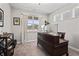 Modern home office with ample natural light, a large desk, comfortable chair, and street view at 20170 Edwick Dr, Westfield, IN 46074