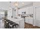 Bright kitchen with stainless steel appliances, white cabinets, pendant lighting, and island with seating at 20170 Edwick Dr, Westfield, IN 46074