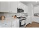 Bright kitchen with stainless steel appliances, white cabinets, and counter-top appliances at 20170 Edwick Dr, Westfield, IN 46074