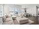 Bright living area with modern sofa, large windows with shades and open floorplan at 20170 Edwick Dr, Westfield, IN 46074