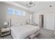 Airy primary bedroom with a tray ceiling, a neutral palette, and an ensuite bathroom entrance at 20170 Edwick Dr, Westfield, IN 46074