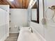 Bathroom with a white vanity, framed mirror, and bathtub shower combo at 205 S Market St, Thorntown, IN 46071