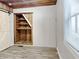 Bedroom featuring a custom built in wood shelving unit at 205 S Market St, Thorntown, IN 46071