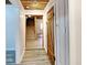 Hallway with a view of the stairs and light wood plank flooring at 205 S Market St, Thorntown, IN 46071
