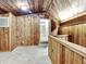 Charming room features wood walls, carpet flooring, stairs, and a view into another room at 205 S Market St, Thorntown, IN 46071