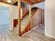 Staircase featuring wood paneling and carpeted steps at 205 S Market St, Thorntown, IN 46071