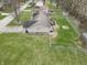 Aerial view of a home with a fenced yard, detached garage, and deck at 2129 Heather Rd, Anderson, IN 46012