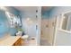 Bathroom features decorative mirrors, glass enclosed shower and natural light at 2129 Heather Rd, Anderson, IN 46012