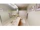 Well lit bathroom featuring a double sink vanity, tile flooring, and a shower with a curtain at 2129 Heather Rd, Anderson, IN 46012