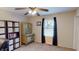 Bedroom featuring neutral colors, carpet flooring, wooden hutch, and a window with black curtains at 2129 Heather Rd, Anderson, IN 46012