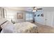 Comfortable bedroom features a ceiling fan, floral bedding and natural light from window at 2129 Heather Rd, Anderson, IN 46012