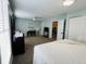 Spacious bedroom with ceiling fan, desk area, and walk-in closet at 2129 Heather Rd, Anderson, IN 46012