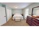 Bright bedroom with large windows, dresser, closets and white bedding at 2129 Heather Rd, Anderson, IN 46012
