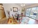 Cozy dining area featuring a round table, decorative rug, and access to the deck at 2129 Heather Rd, Anderson, IN 46012