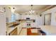 Bright kitchen with stainless steel appliances, white cabinets, and decorative backsplash at 2129 Heather Rd, Anderson, IN 46012