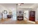 Open-concept living space with dining area and kitchen, plenty of light and natural wood at 2129 Heather Rd, Anderson, IN 46012