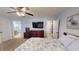Spacious main bedroom with en-suite bathroom, flat screen TV and floral bedding at 2129 Heather Rd, Anderson, IN 46012