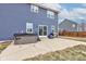 Backyard featuring a hot tub, grill, and a concrete patio for outdoor enjoyment at 2627 Chalbury Dr, Plainfield, IN 46168