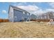 Expansive backyard with a patio, hot tub, play set, and ample green space at 2627 Chalbury Dr, Plainfield, IN 46168