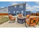 Cozy backyard patio with fire pit, hot tub, grill, and comfortable seating, perfect for outdoor entertaining at 2627 Chalbury Dr, Plainfield, IN 46168