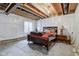 Unfinished basement with exposed ceiling, a bed, and lots of space for storage at 2627 Chalbury Dr, Plainfield, IN 46168