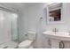 Clean bathroom with a glass-enclosed shower and a pedestal sink with modern fixtures at 2627 Chalbury Dr, Plainfield, IN 46168