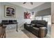 Bedroom featuring gray walls, sports decor, a comfortable couch, and a window with blinds at 2627 Chalbury Dr, Plainfield, IN 46168