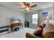 Bedroom with a ceiling fan, sofa, TV, desk, and window for natural lighting at 2627 Chalbury Dr, Plainfield, IN 46168