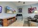 Cozy room with sports memorabilia, a comfortable leather couch, and a ceiling fan at 2627 Chalbury Dr, Plainfield, IN 46168
