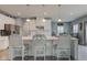 Bright kitchen island features pendant lighting, bar stool seating, and modern appliances at 2627 Chalbury Dr, Plainfield, IN 46168