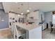 Expansive kitchen island with a sink, bar stools, and an open floor plan at 2627 Chalbury Dr, Plainfield, IN 46168