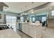 Modern kitchen boasts an island with bar seating and an open view of the living area at 2627 Chalbury Dr, Plainfield, IN 46168