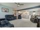 Open concept living room showcases plush seating and seamless flow into the adjacent kitchen at 2627 Chalbury Dr, Plainfield, IN 46168