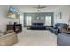 Bright living room with comfortable seating, a ceiling fan, and a modern entertainment center at 2627 Chalbury Dr, Plainfield, IN 46168