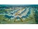 Aerial view of a well-maintained neighborhood with neatly arranged homes, green spaces, and community amenities at 2627 Chalbury Dr, Plainfield, IN 46168