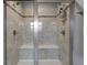Spacious tiled shower with dual shower heads and built in bench at 2627 Chalbury Dr, Plainfield, IN 46168