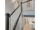 Open staircase with white railing and dark wood trim, leading to multiple rooms on the upper level at 2627 Chalbury Dr, Plainfield, IN 46168