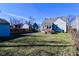 Backyard featuring a well-kept lawn with a partial fence at 3533 N Grant Ave, Indianapolis, IN 46218