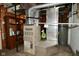 Basement utility area featuring a furnace, water heater, and wood cabinet for storage, ensuring comfort and functionality at 3533 N Grant Ave, Indianapolis, IN 46218