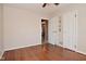 A bedroom with hardwood floors features two closets and an open doorway for easy access at 3533 N Grant Ave, Indianapolis, IN 46218