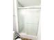 Shower with glass doors and white tiled walls at 3656 Allison Ave, Indianapolis, IN 46224