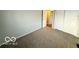 Bedroom featuring carpeted floors and a closet at 3656 Allison Ave, Indianapolis, IN 46224